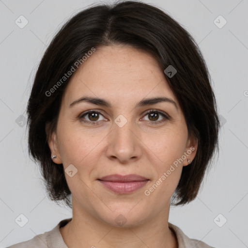 Joyful white adult female with medium  brown hair and brown eyes