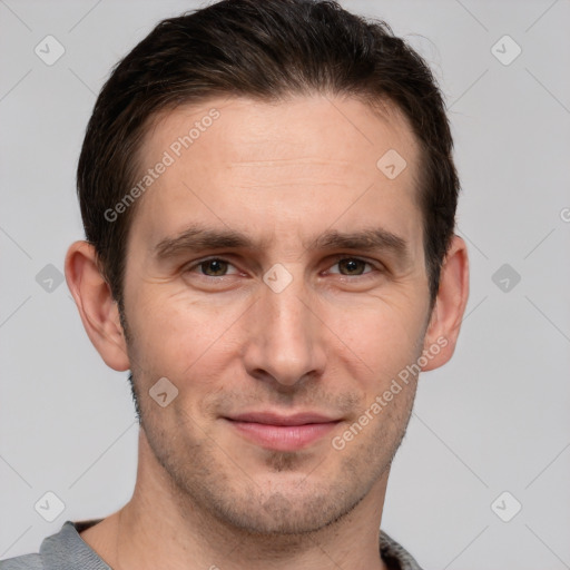 Joyful white adult male with short  brown hair and brown eyes