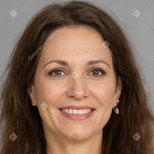 Joyful white adult female with long  brown hair and brown eyes