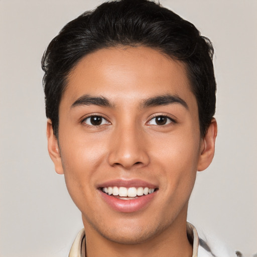 Joyful white young-adult male with short  black hair and brown eyes