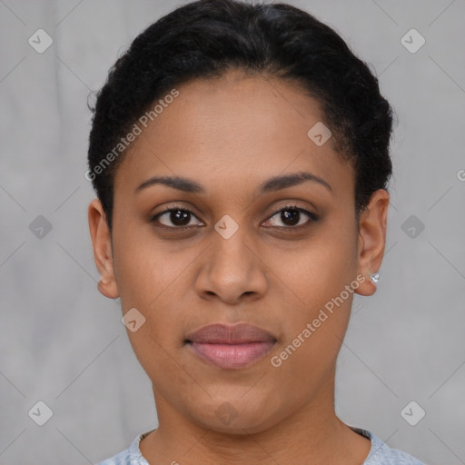 Joyful latino young-adult female with short  black hair and brown eyes