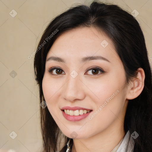 Joyful asian young-adult female with long  brown hair and brown eyes