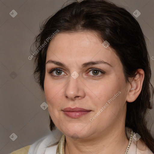 Joyful white adult female with medium  brown hair and brown eyes