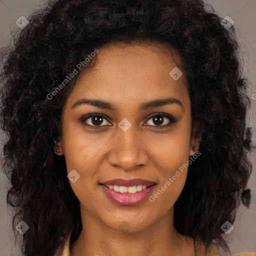 Joyful black young-adult female with long  brown hair and brown eyes