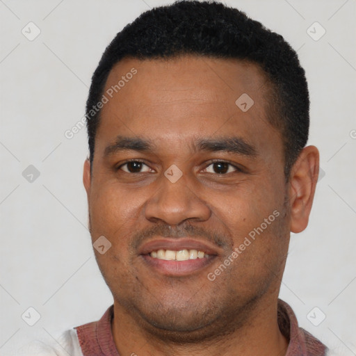 Joyful latino young-adult male with short  black hair and brown eyes