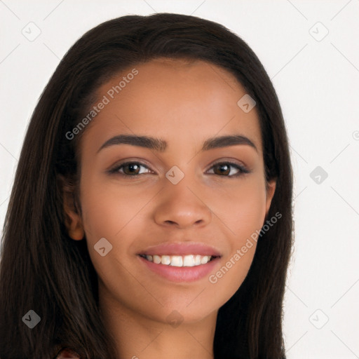 Joyful latino young-adult female with long  brown hair and brown eyes