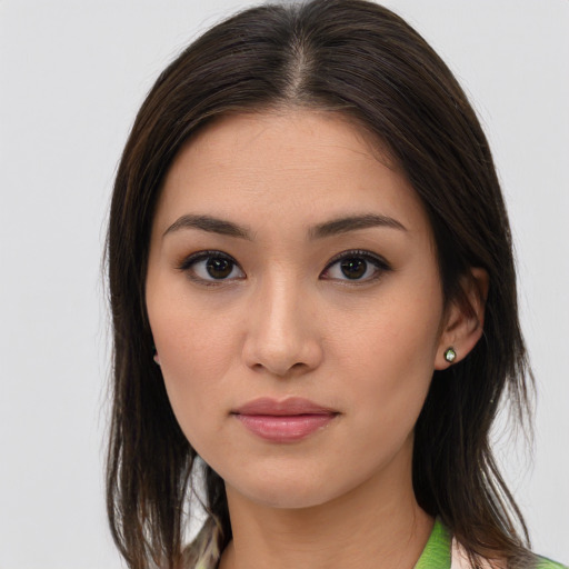 Joyful asian young-adult female with medium  brown hair and brown eyes