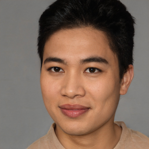 Joyful asian young-adult male with short  brown hair and brown eyes