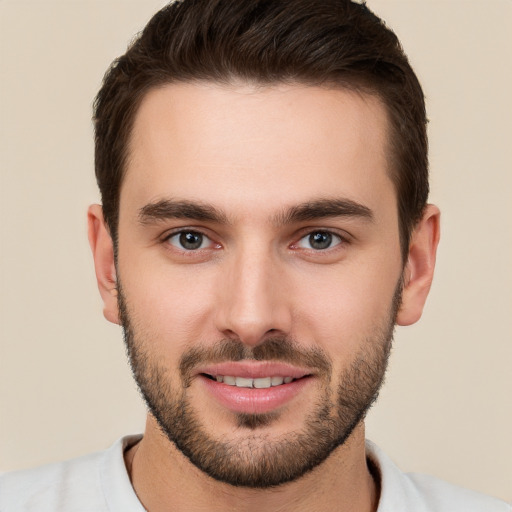 Joyful white young-adult male with short  brown hair and brown eyes