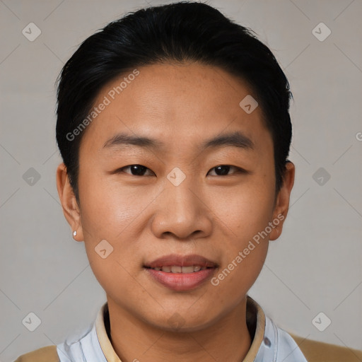 Joyful asian young-adult male with short  black hair and brown eyes