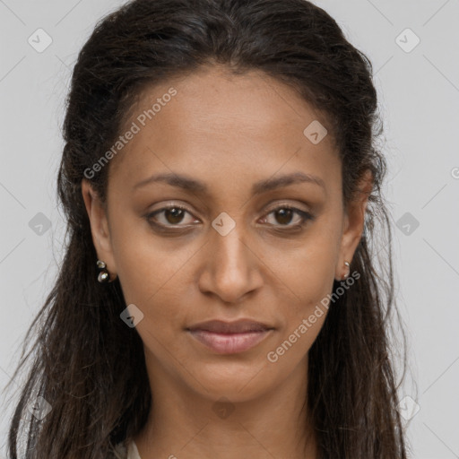 Joyful black young-adult female with long  brown hair and brown eyes