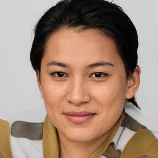 Joyful asian young-adult female with medium  brown hair and brown eyes