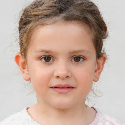 Joyful white child female with short  brown hair and brown eyes