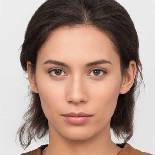 Neutral white young-adult female with medium  brown hair and brown eyes