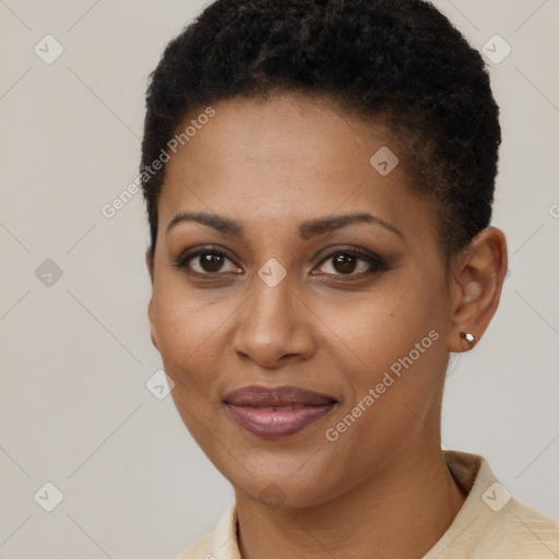 Joyful black young-adult female with short  brown hair and brown eyes