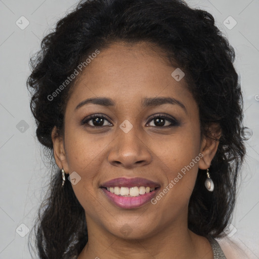 Joyful black young-adult female with long  brown hair and brown eyes