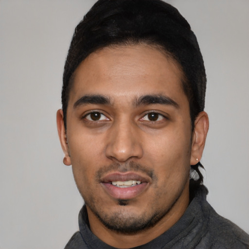 Neutral latino young-adult male with short  black hair and brown eyes