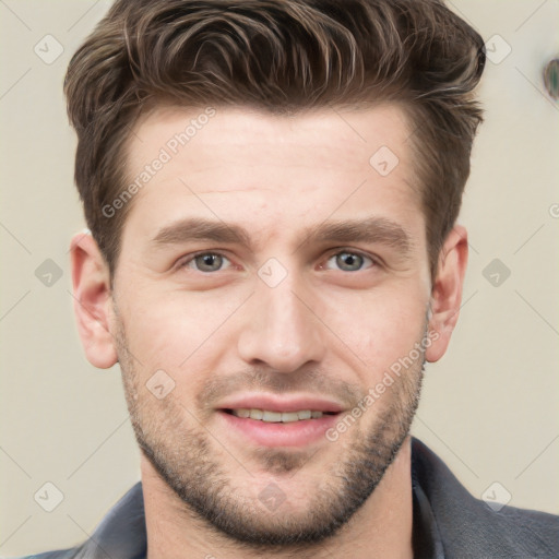 Joyful white young-adult male with short  brown hair and grey eyes