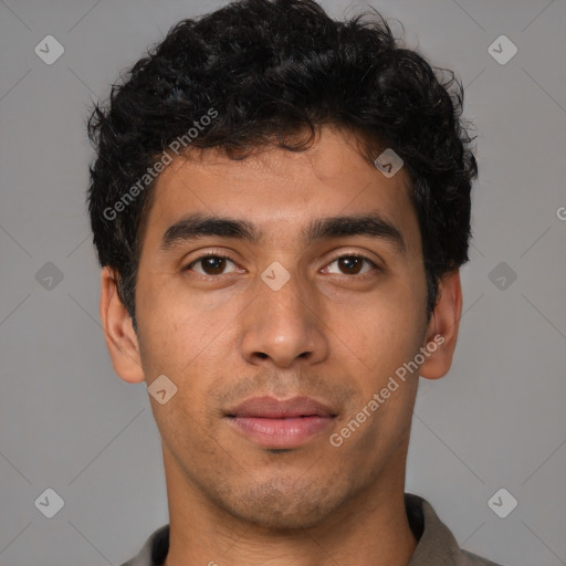 Joyful latino young-adult male with short  brown hair and brown eyes