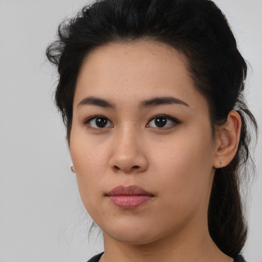 Neutral latino young-adult female with medium  brown hair and brown eyes