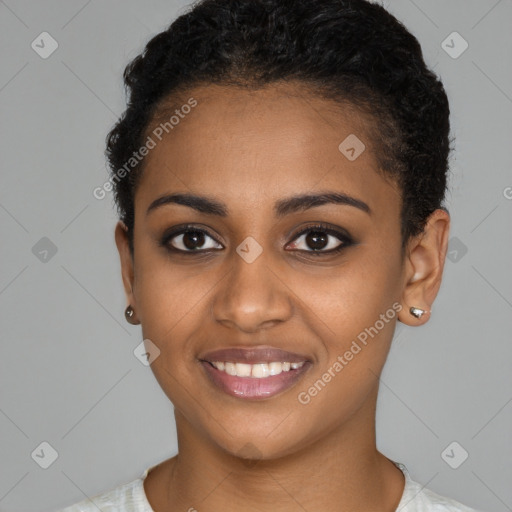 Joyful black young-adult female with short  brown hair and brown eyes