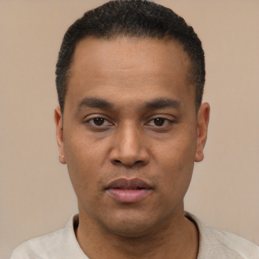 Neutral latino young-adult male with short  black hair and brown eyes