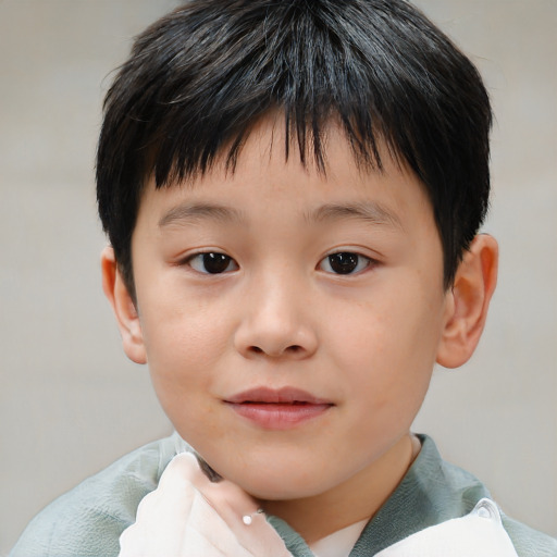 Joyful white child male with short  brown hair and brown eyes