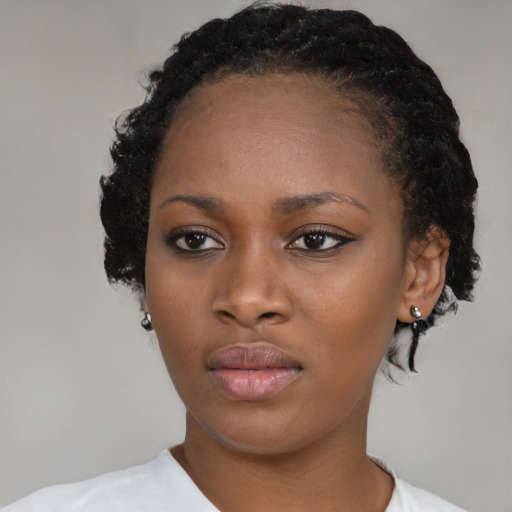 Neutral black young-adult female with medium  black hair and brown eyes