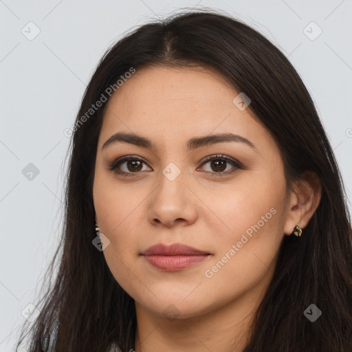 Joyful latino young-adult female with long  brown hair and brown eyes