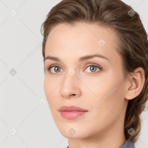 Neutral white young-adult female with long  brown hair and brown eyes