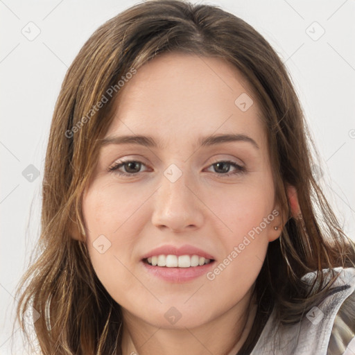 Joyful white young-adult female with long  brown hair and grey eyes