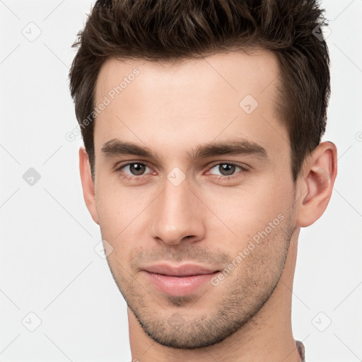 Neutral white young-adult male with short  brown hair and brown eyes