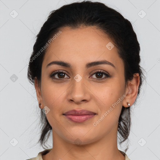 Joyful latino young-adult female with medium  brown hair and brown eyes