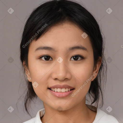 Joyful asian young-adult female with medium  black hair and brown eyes