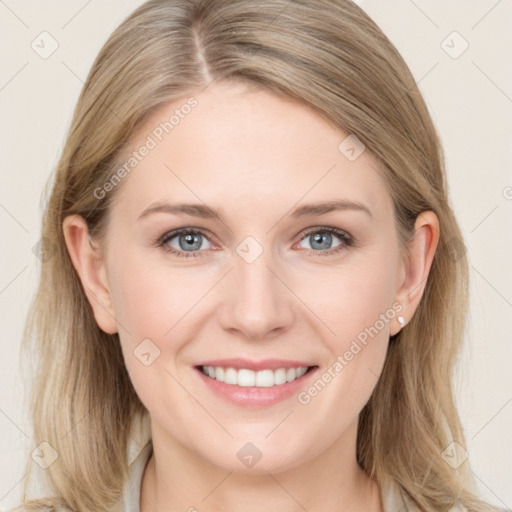 Joyful white young-adult female with medium  brown hair and blue eyes