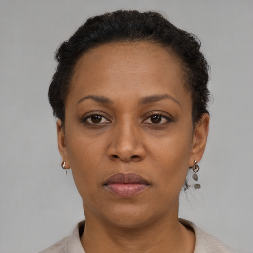 Neutral black adult female with short  black hair and brown eyes