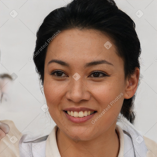 Joyful asian young-adult female with short  brown hair and brown eyes