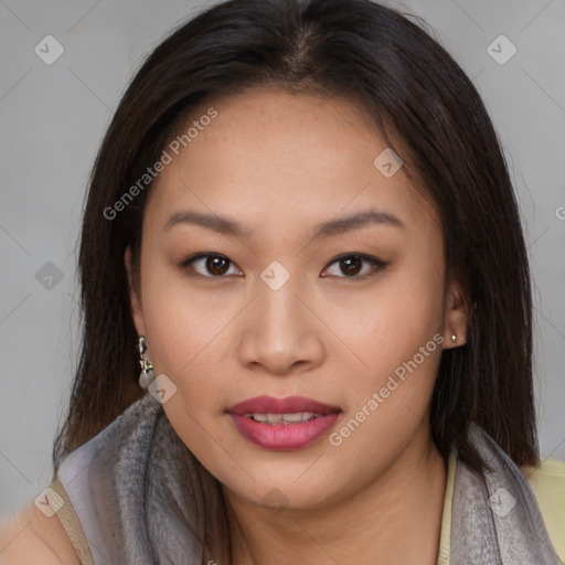 Joyful asian young-adult female with long  brown hair and brown eyes