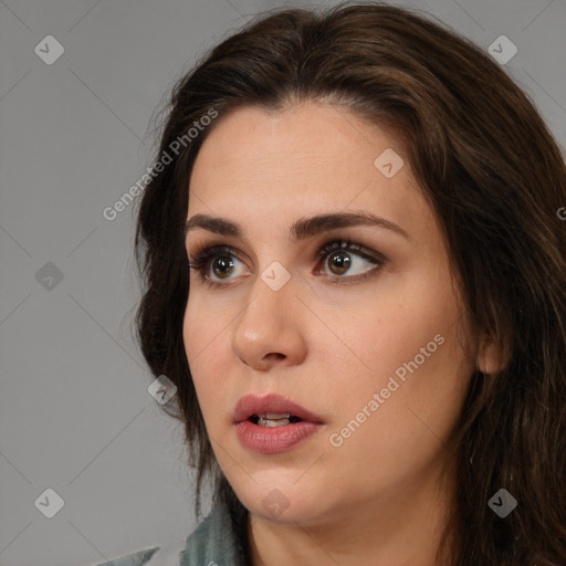 Neutral white young-adult female with long  brown hair and brown eyes