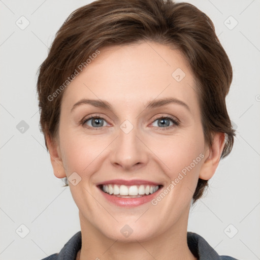 Joyful white young-adult female with short  brown hair and grey eyes