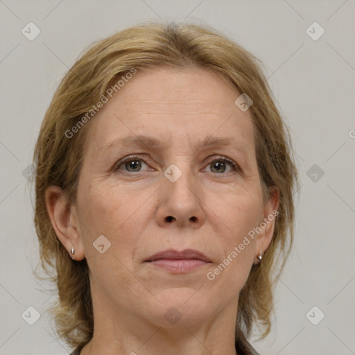 Joyful white adult female with medium  brown hair and grey eyes