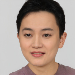 Joyful asian young-adult female with short  black hair and brown eyes