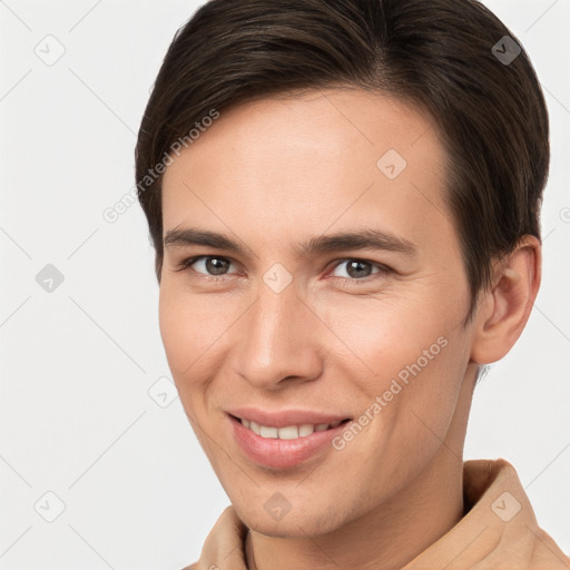 Joyful white young-adult female with short  brown hair and brown eyes