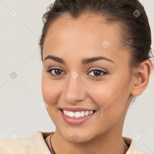 Joyful white young-adult female with short  brown hair and brown eyes