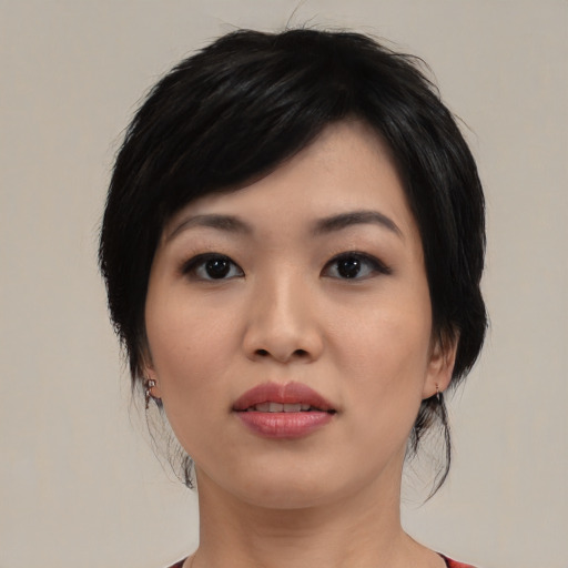 Neutral asian young-adult female with medium  black hair and brown eyes