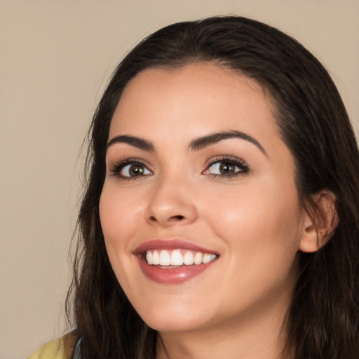 Joyful white young-adult female with long  black hair and brown eyes