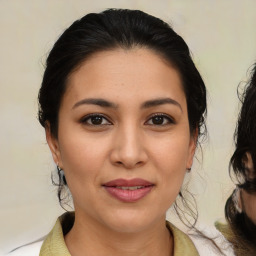 Joyful asian young-adult female with medium  brown hair and brown eyes