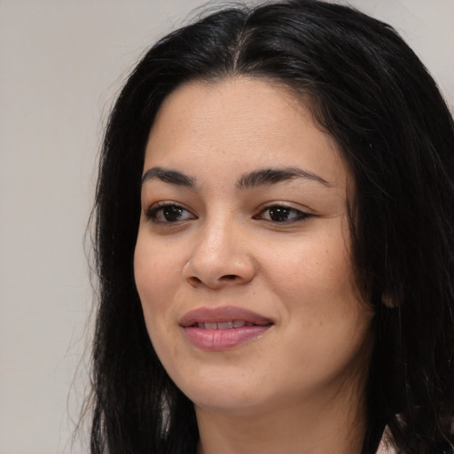 Joyful asian young-adult female with long  black hair and brown eyes