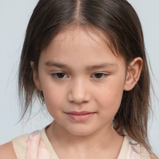 Joyful white child female with medium  brown hair and brown eyes