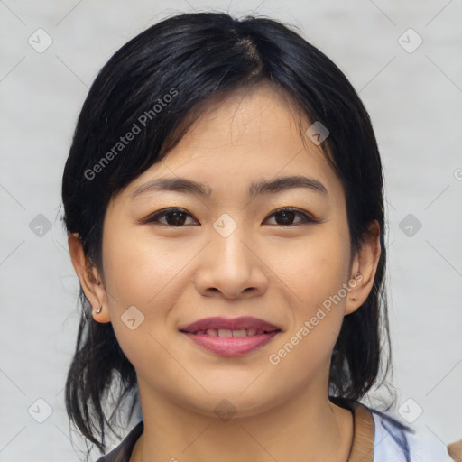 Joyful asian young-adult female with medium  black hair and brown eyes